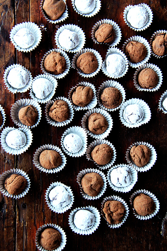 Overhead shot of boozy chocolate truffles on a table.