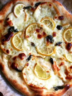 A just-baked lemon and smoked mozzarella pizza.