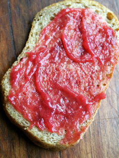 A slice of toast with rhubarb jam.