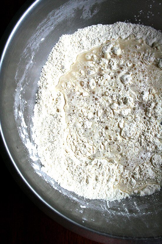 Overhead view of unmixed dough in mixing bowl
