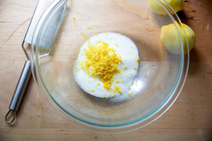 A bowl filled with sugar and lemon zest.