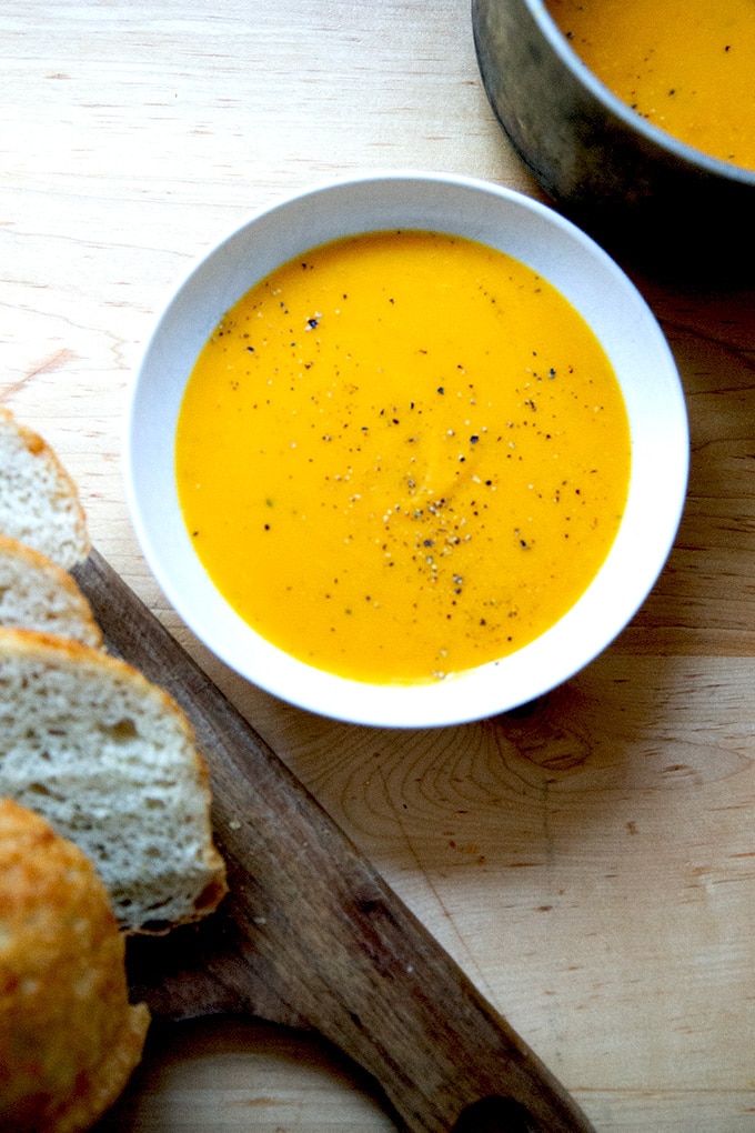 A bowl of roasted butternut squash and garlic soup.