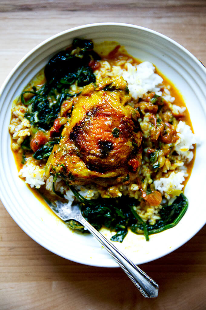 A bowl of one-pot Thai chicken curry with spinach and rice