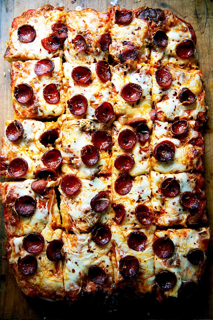 Just-baked Sicilian-style pepperoni pizza, cut into squares.