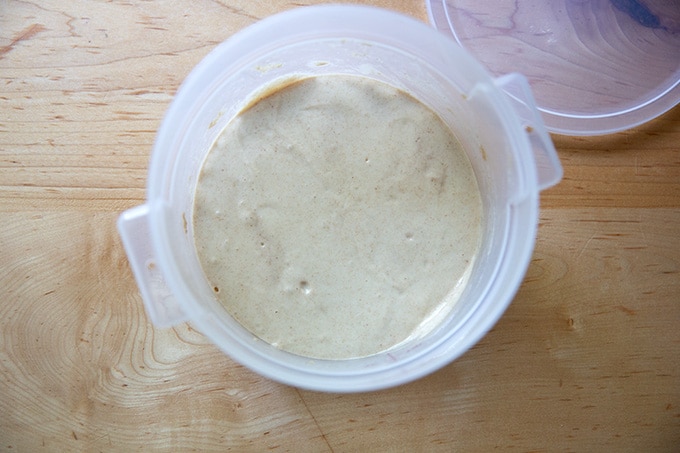 A 2-quart container holding sourdough starter.