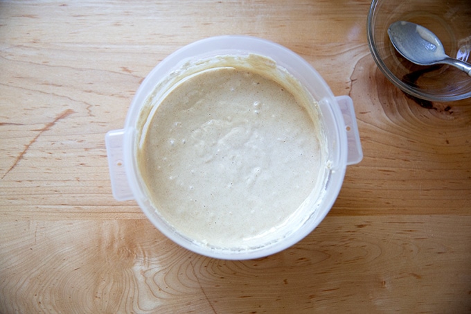 A 2-quart container holding sourdough starter, just mixed.