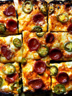 Detroit-style pizza topped with pepperoni and pickled jalapeños.