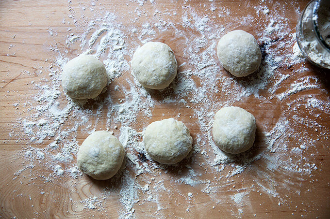 Six rounds of pita bread dough.