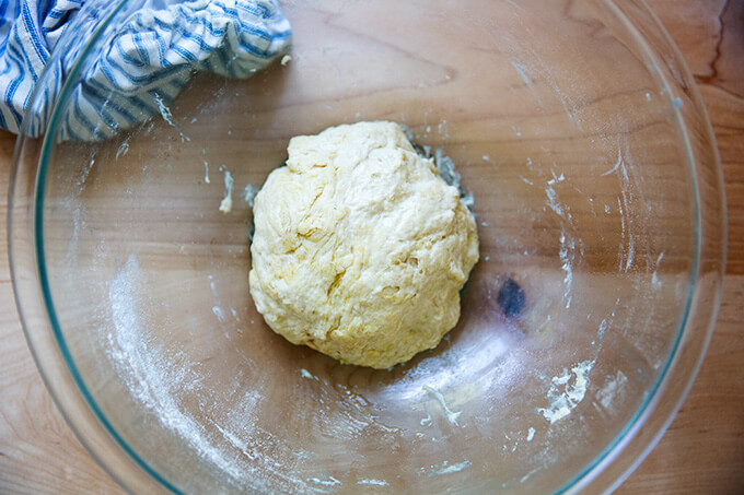 Mixed pita bread dough in a bowl.