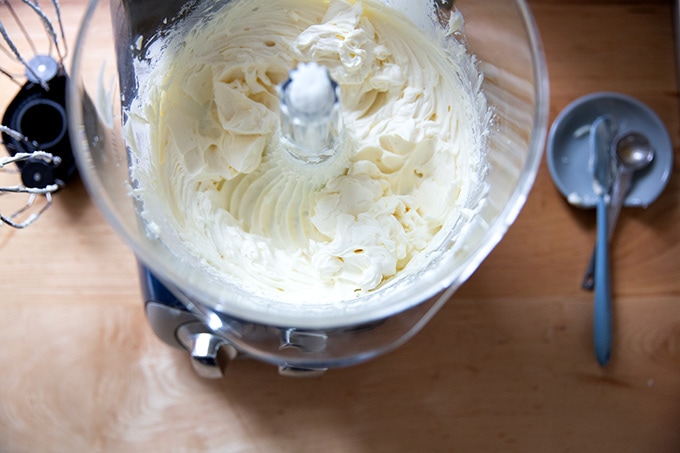 Just-beaten whipped cream - cream cheese frosting in a stand mixer.