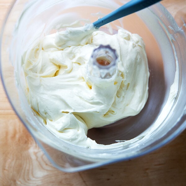 Beaten whipped cream - cream cheese frosting in a stand mixer.