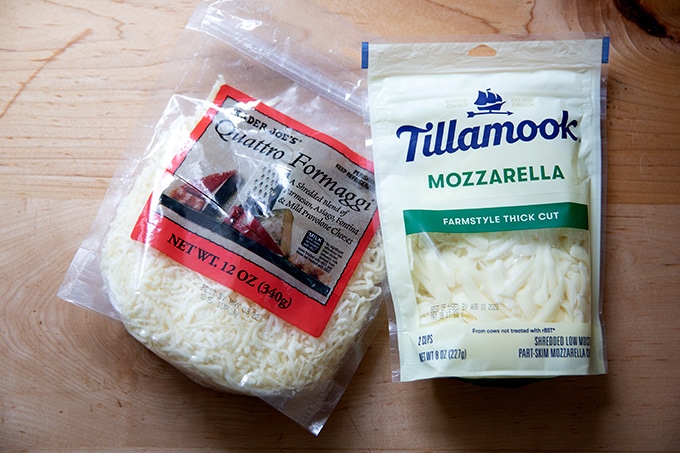 Two bags of grated cheese.