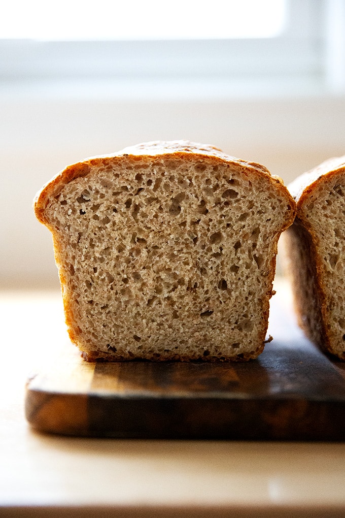 Halved loaf of rye bread.
