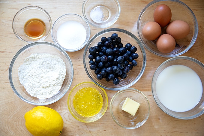 The ingredients to make blueberry Dutch Baby on a countertop.