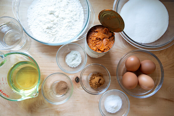 Ingredients to make one-bowl pumpkin bread on a countertop.