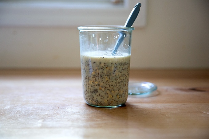 A Weck jar filled with overnight chia oats ready to be stashed in the fridge.