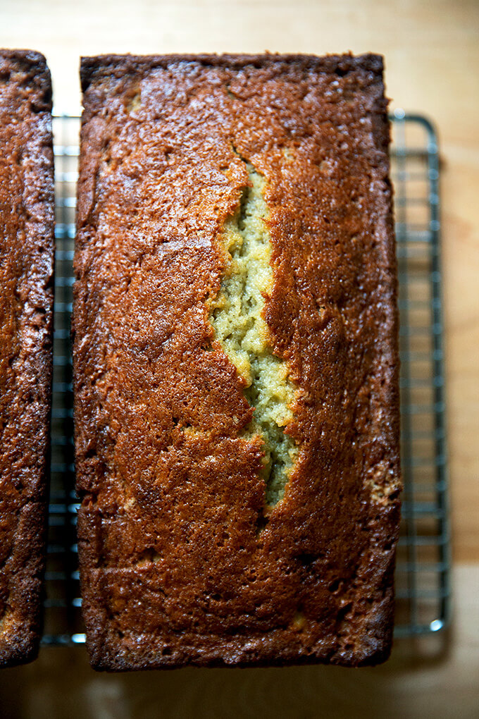 Just-baked banana bread on a cooling rack.