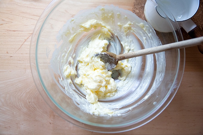 A bowl of softened butter in a bowl.