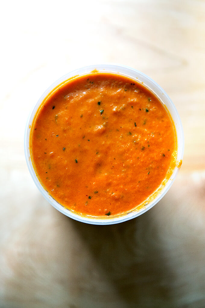 An overhead shot of homemade vodka sauce in a quart container.