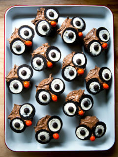 A tray of cupcakes decorated as owls.