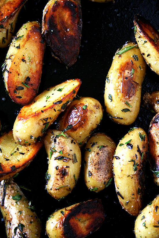 These fingerling potatoes are cooked perfectly, not the slightest bit overdone. And moreover, they are seasoned perfectly, too, not a bit too salty and subtly infused with the flavors of rosemary, thyme and garlic. It's such a treat. I think you'll like them, too. // alexandracooks.com