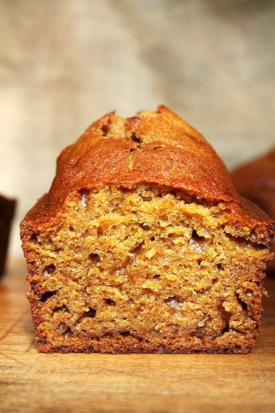 A cross-section of a loaf of mini pumpkin bread. 