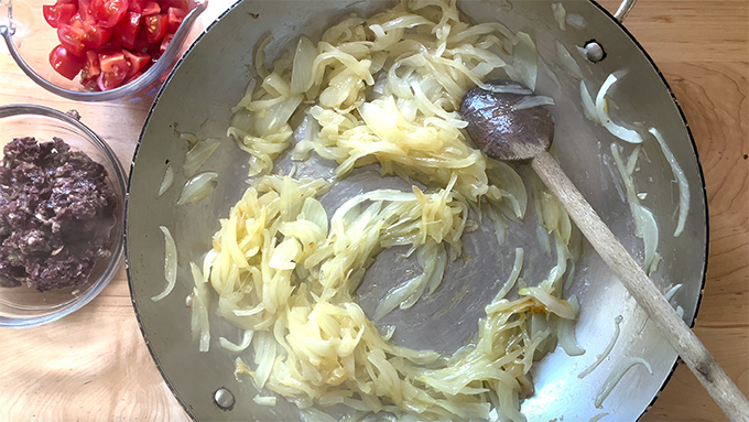 Caramelized onions in a sauté pan.