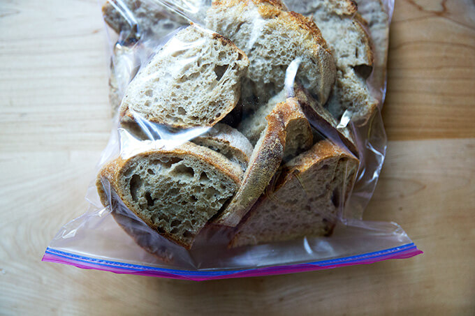 A ziplock bag filled with sliced whole wheat sourdough bread.