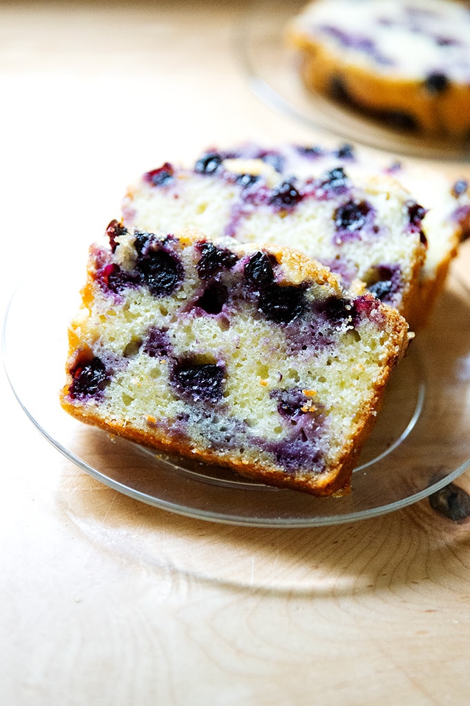 Slices of lemon-blueberry quick bread on a plate.