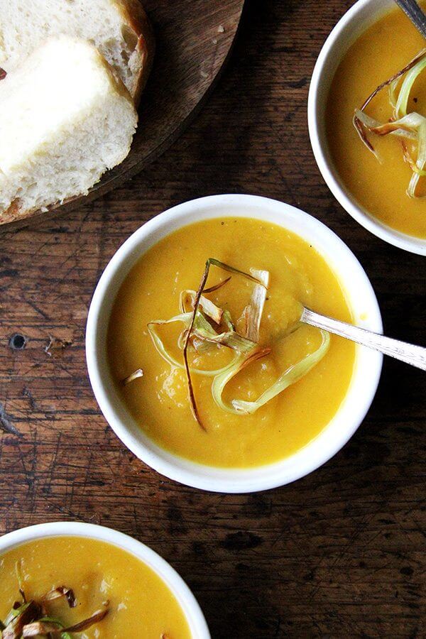 A bowl of Slow cooker butternut squash soup with apple and coconut milk.