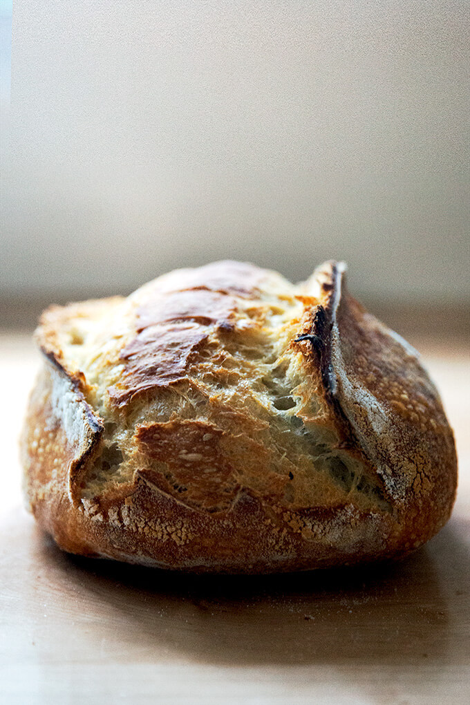 A freshly baked loaf of sourdough bread. 
