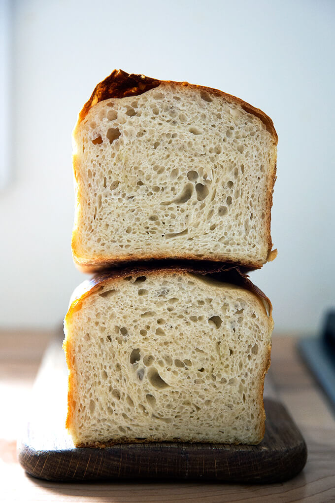 A halved loaf of sourdough sandwich (or toasting) bread.
