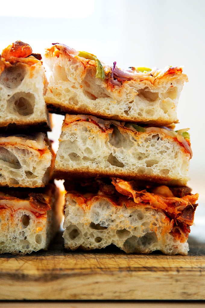 A stack of Sicilian-style pizza squares.